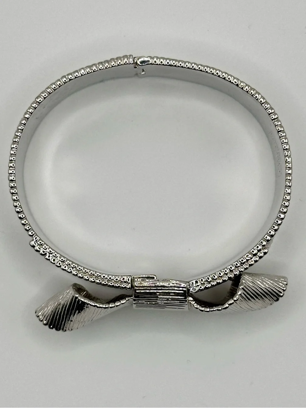 Kate Spade All Wrapped Up Textured Silver Tone Bow Bracelet Structured Bangle KS - Picture 3 of 8